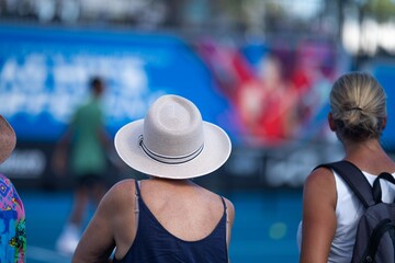 australian open crowds watching tennis matches on a hot summer day