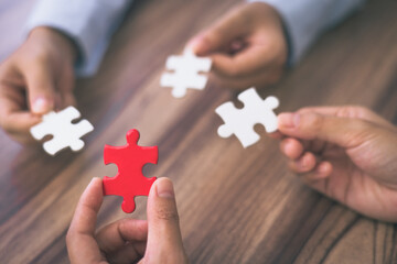 Hand of woman connecting jigsaw puzzle, Business solutions, success and strategy, Business...