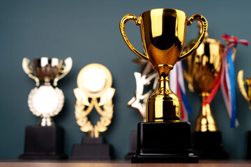 Gold Trophy with a row of gold trophy background