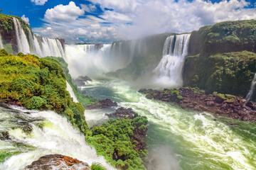 Iguazu Falls in Brazil and Argentina, beautiful waterfalls in sunny day
