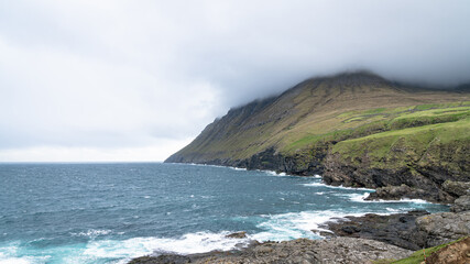 Fototapeta na wymiar Dramatic landscape scenery on Faroe Islands. The nature of the Faroe Islands in the north Atlantic is full of beautiful landscape.