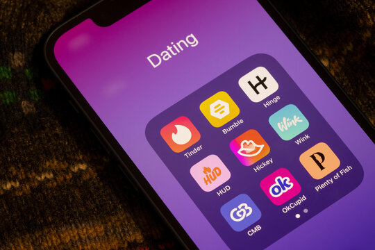 Redmond, WA, USA - Jan 13, 2024: Assorted dating apps, including Tinder, Bumble, Hinge, HUD, Hickey, Wink, Coffee Meets Bagel (CMB), OkCupid, and Plenty of Fish (POF), are seen on an iPhone.