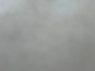 Dark Sky Abstract: Ethereal Smoke and Fog Motion in Nature's Night Atmosphere with Blue and White Cloud-like Texture