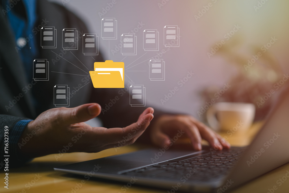 Aufkleber Document management system concept, businessman holding folder and document icon software, searching and managing files online document database, for efficient archiving and company data..