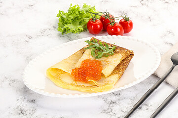 Russian pancake with red caviar