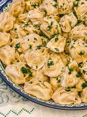 Traditional Asian dumplings -manti on a plate. Steamed meat dumplings. Meat manta rays