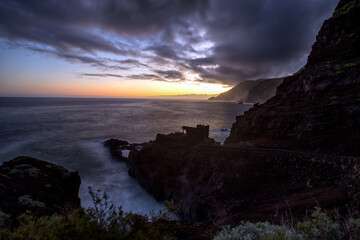 Sunset at the rough coast (La Fajana) in the north of the island of La Palma (Canaries, Spain)