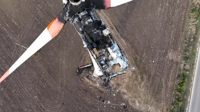Close-up of a burnt out wind turbine. Wind energy farm turbine destroyed, damaged by fire after a lightning strike. Windmill, energy production