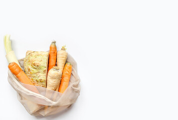 Vegetables set from local market in reusable shopping bag over light background. Copyspace. Top view. Organic food, edible fresh picked. Plastic Pollution, Ethical Consumerism, Healthy Eating concept