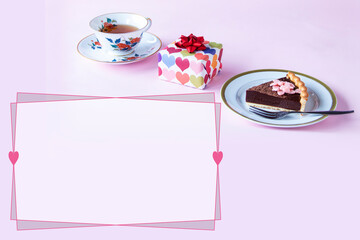 バレンタイン　手作りチョコレートタルトとプレゼントと紅茶のフレーム（ペールピンクの背景）