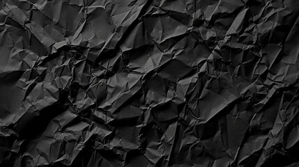 Black crumpled paper background or texture. Crumpled paper.