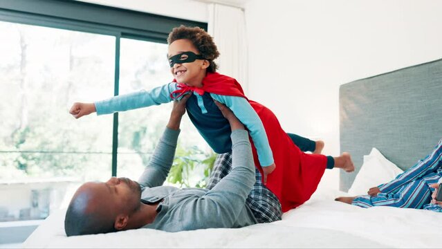 Man, child and superhero or bed game for morning connection or superman costume, playing or holiday. Black person, son and hand for power balance pose on mattress or mother bond, siblings or together