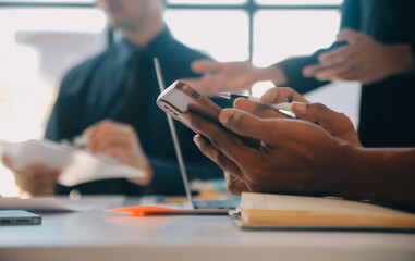 Business team working with new startup project plan and discussion information for financial strategy with laptop and digital tablet in a modern business lounge.