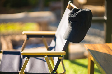 Black cap on camping chair.