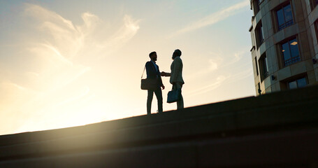 Business people, handshake and city silhouette for partnership, outdoor introduction and travel...