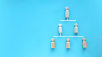 Company hierarchical organizational chart of blocks on blue background with copy space.