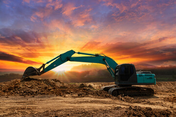 Crawler excavator digging the soil,In the construction site on the sunset  background .