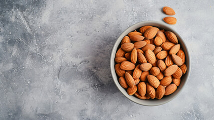 From above ceramic bowl with organic almonds