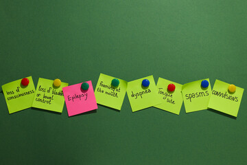 Symptoms of epilepsy on pieces of paper