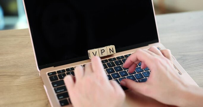 VPN technology and network security on laptop. Person cyber security concept typing on keyboard
