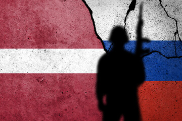 Flag of Latvia and Russia painted on a concrete wall.