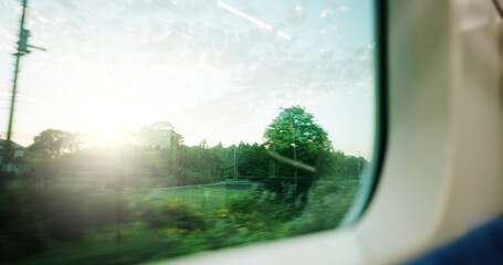Train, window and nature view for moving transportation in Japan for adventure, commute or travel. Locomotive, speed and outdoor forest or railway journey in countryside or vacation, carriage or trip