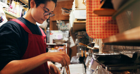 Japanese chef man, cooking and chopsticks by stove, service or catering job on heat, flame or...