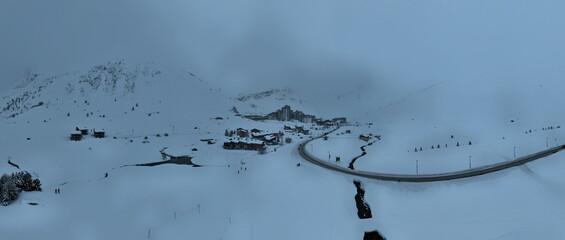 Blizzard Over French Alps Mountains. Aerial Time Lapse Over snowy and bad weather mountain. Harsh Wild Environment. Natural Phenomena in Tignes