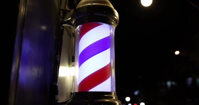 Barber shop and barbershop symbol colorful texture of bright primary colors blue red white. Male hairdressers sign and colorful light