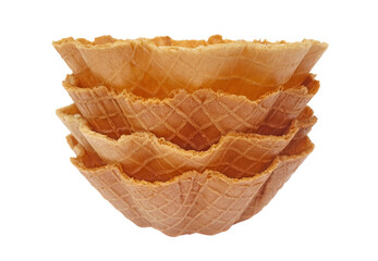 Pile of edible waffle bowls isolated on white background. Sweet and crunchy wafer cone cup for dessert, ice cream and salad.