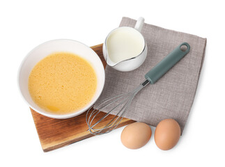 Fototapeta na wymiar Metal whisk, beaten eggs and milk isolated on white