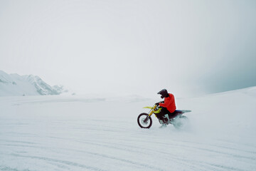 Winter motocross. Racers ride on ice. Winter sports.