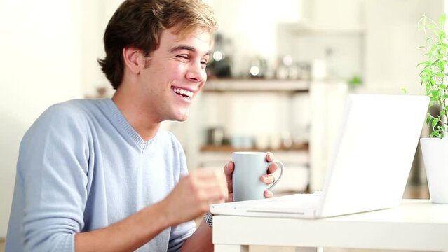Video call, laptop and man blow kiss on online meeting, communication and flirting with networking contact. Home computer, love and person smile on web conference, discussion or virtual conversation
