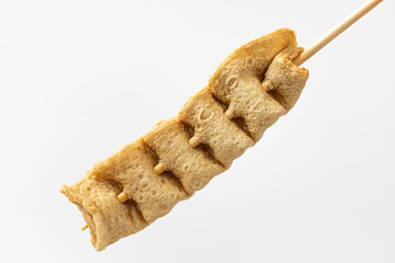 Skewered fish cake on white background