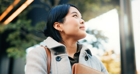 Business, woman and happy in Japan for travel, commute or morning journey to work in the city....