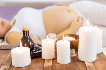 Obraz na płótnie Canvas Young pregnant woman have massage treatment at spa