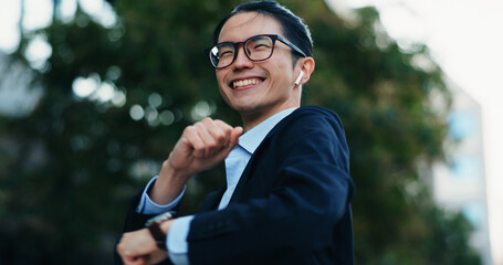 Happy, dancing and Japanese businessman in the city with good news, job promotion or achievement....