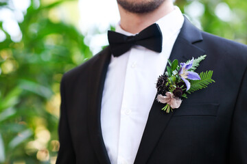 Gentle groom boutonniere with roses