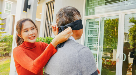 Beautiful grown daughter uses  black cloth to cover her eyes surprise her retired elderly father by buying her new house as a gift and delighting her with luxurious and expensive new house.