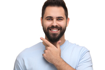 Man showing his clean teeth and smiling on white background