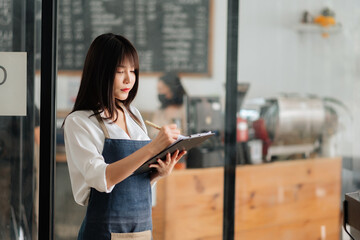 Startup successful small business owner sme woman stand with tablet  in cafe restaurant. .