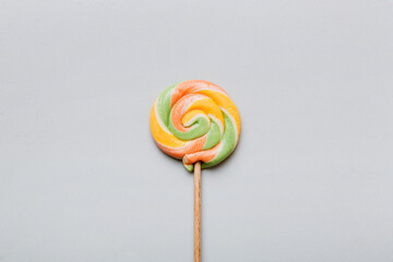 Colorful candies, lollypop on the colorful background, multicolored minimal style top view
