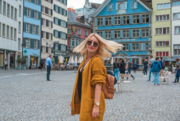 Vacation in Switzerland - Zurich. Concept of tourism and holidays. Woman in city streets, urban scene