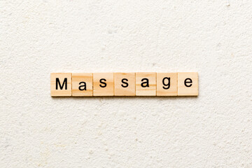 massage word written on wood block. massage text on cement table for your desing, concept