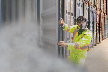 male rescue worker ppe wearing mask protection inspects tank containing dangerous poison illegal...