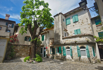 Old buildings in the beach town of Grado in north east Italy in sunny summer day. - 716498701