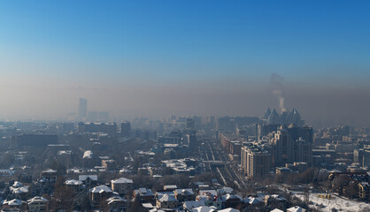 Strong smog over the Kazakh city of Almaty on a winter day