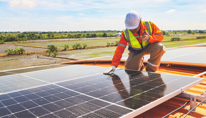 Meticulous male engineer reports walkie talkie radio to inspect solar panels on a safe industrial factory roof during work. Using renewable energy from the sun, alternative energy from entrepreneurs.