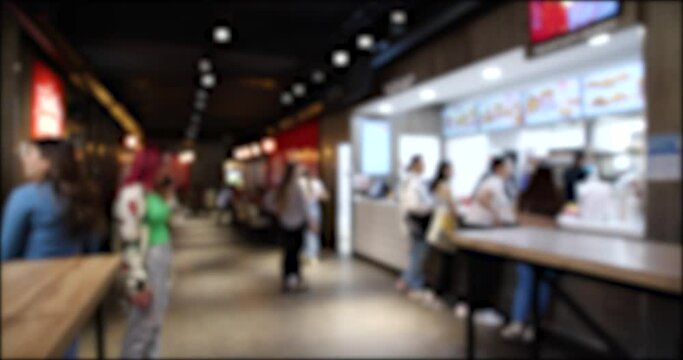 Time Lapse video of People Walking and Ordering from a Fast Food restaurant. Blurred background 4K video.
