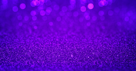 Sparkling purple glitter background with magenta bokeh. Closeup view, dof. Pattern with shining...